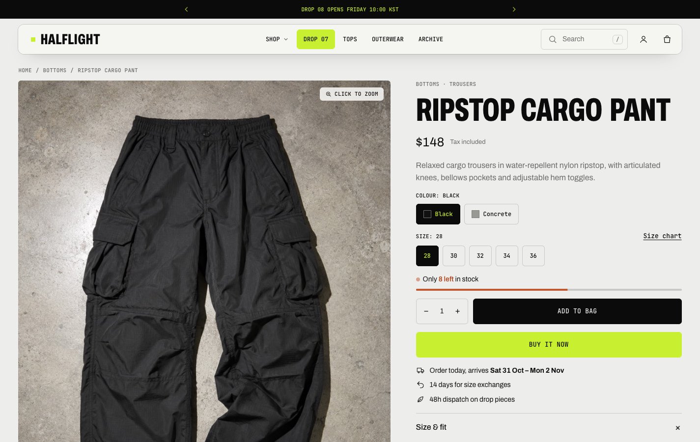 Graphite product page for cargo pants, with color and size pickers, a size chart link and a lime buy it now button.
