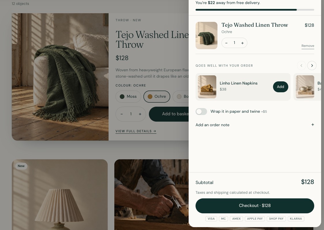 The cart drawer open with a free delivery progress bar, a suggested product, a gift wrap toggle and checkout.